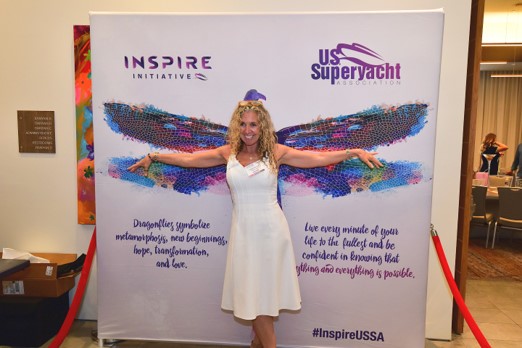 Woman in front of dragonfly backdrop